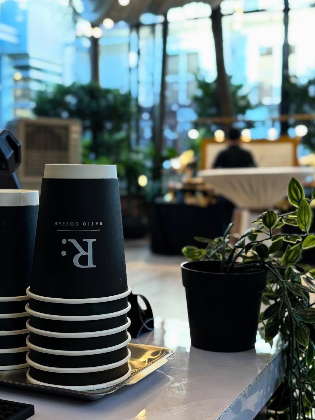 Ratio Coffee barista serving at event